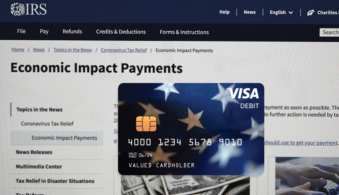 sample look at a stimulus payment debit card with a screen of the IRS website in the background
