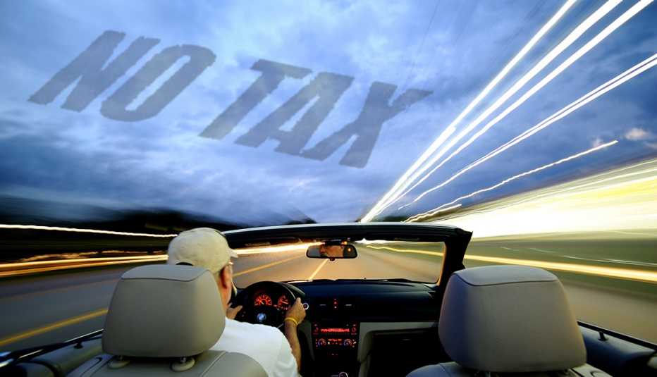 view of man driving open top convertible car towards an unknown destination - the words NO TAX  are superimposed in the sky