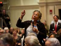 Senior woman speaks about medicare and social security during an AARP event in Richmond, VA on March 20, 2012