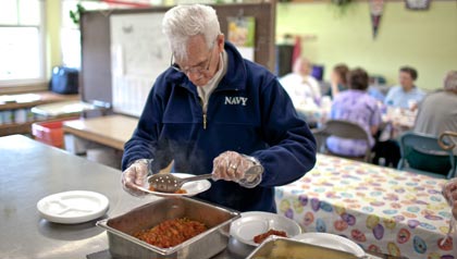 Joe MacFarlane helps prep for Meals on Wheels at the Whipple Senior Center.