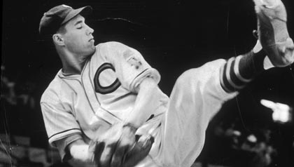 Full-length image of baseball pitcher Bob Feller of the Cleveland Indians winding up for a pitch during practice, Editor's Letter AARP Bulletin May 2013, 00f/45/arve/g2429/059