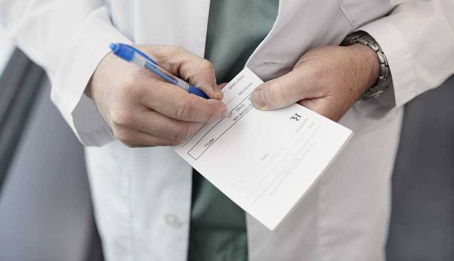 Close up of a doctor filling out a prescription
