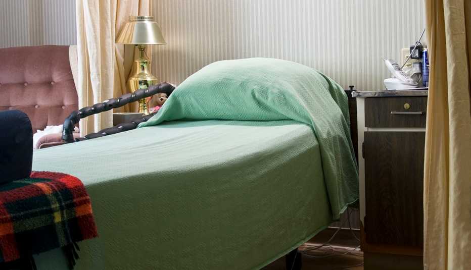 An empty bed in a nursing home