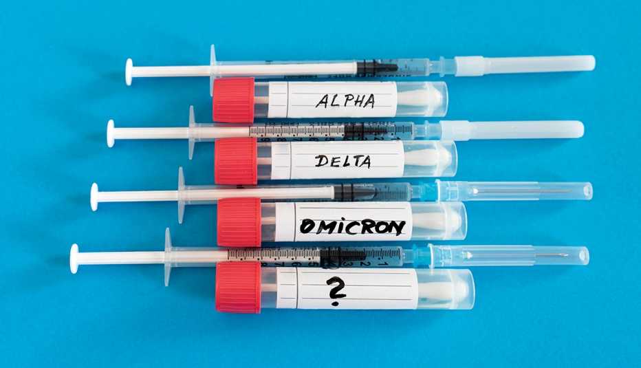 Swab tubes and vaccine syringes for the different COVID-19 variants, alpha, delta, omicron, and question mark