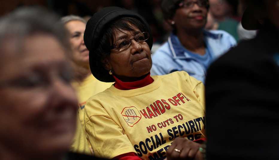 A woman listens to a hearing on Social Security.