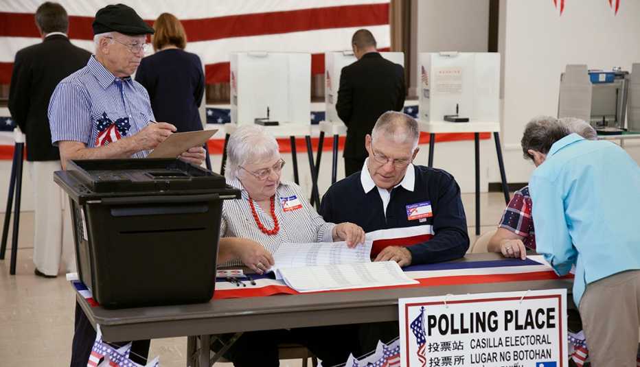 People working at a polling place during an election
