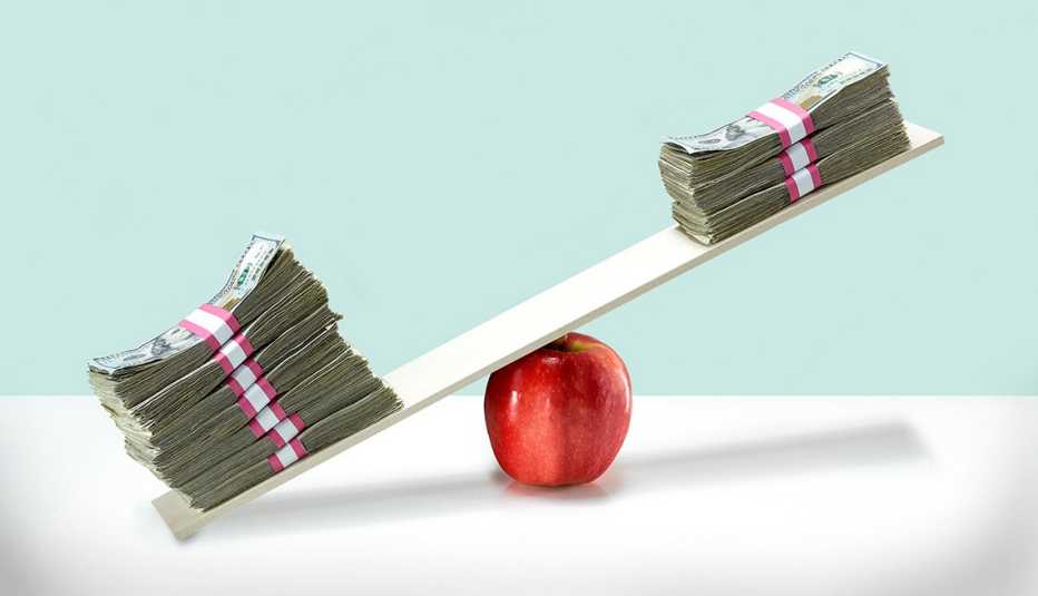 Money balancing on an apple.
