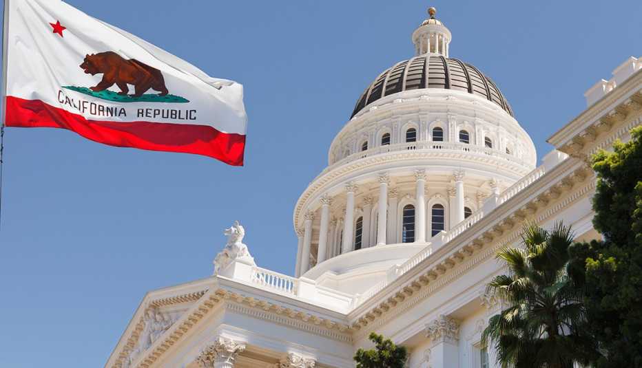 California state capitol building and flag