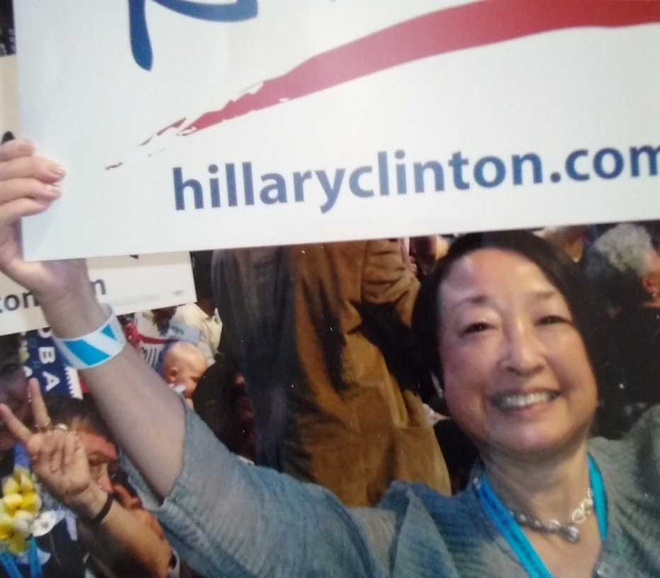 jadine nielsen holding a hillary clinton sign at a past democratic national convention
