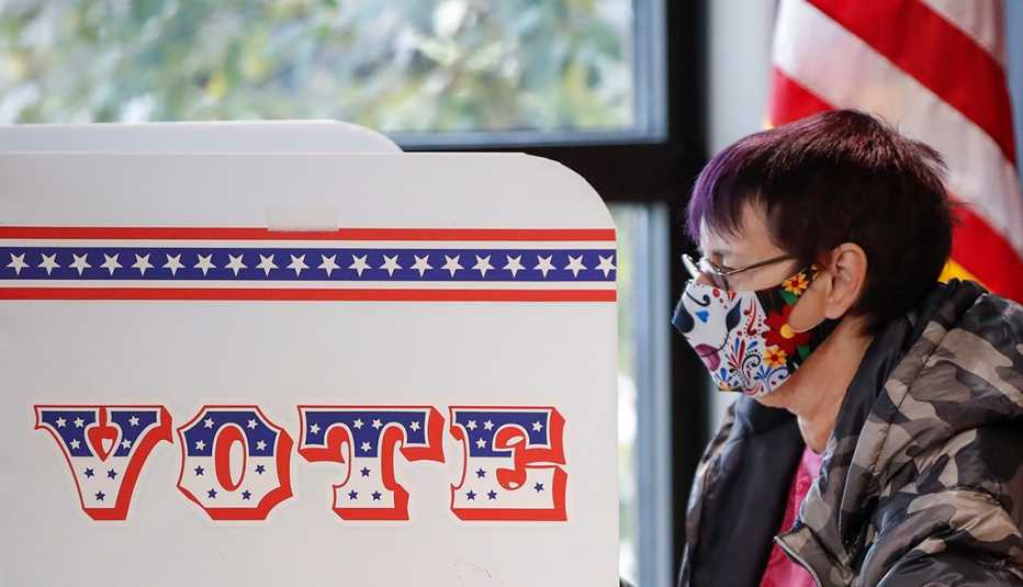 A woman is casting her ballot