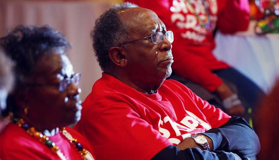 Volunteers wearing red shirts watching the debate in South Carolina