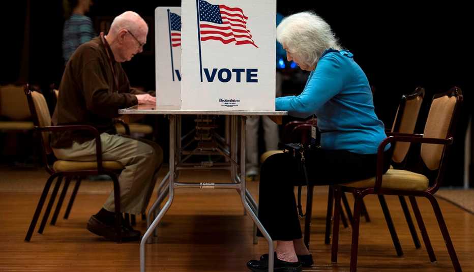 A man and a woman are voting during an election