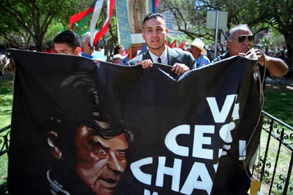 Ricardo Chávez, 26, the nephew of César Chávez, holds a banner with the picture of César Chávez as he leads a procession in El Paso, Texas, on March 31, 2000, in celebration of the birth date of the civil rights leader.