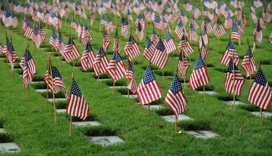 American flags stand at the grave markers