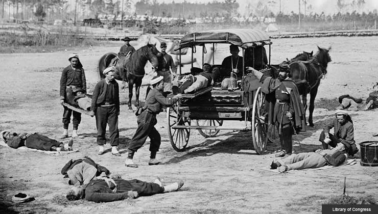 ambulance crew demonstrating removal of wounded soldiers from the field during the Civil War