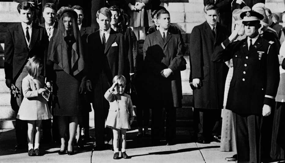 John F kennedy junior salutes his father's coffin on the day of his funeral.