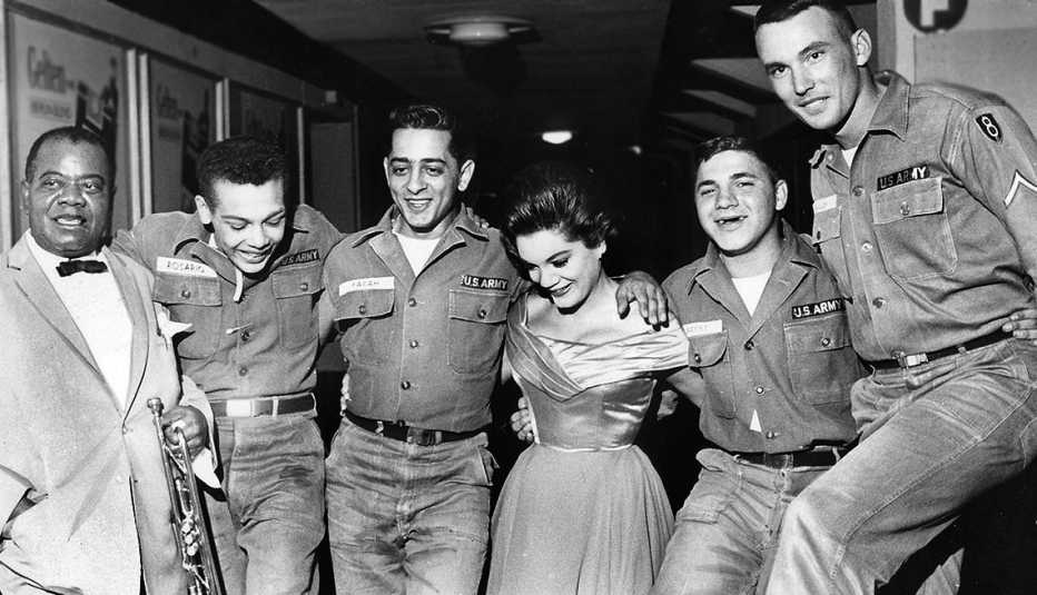 Louis Armstrong, Left, with Connie Francis and US solders  in Berlin's Sportpalast in 1962 