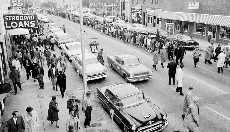 Martin Luther King, Jr. leads a line of African-American protesters down a street in Albany, Georgia