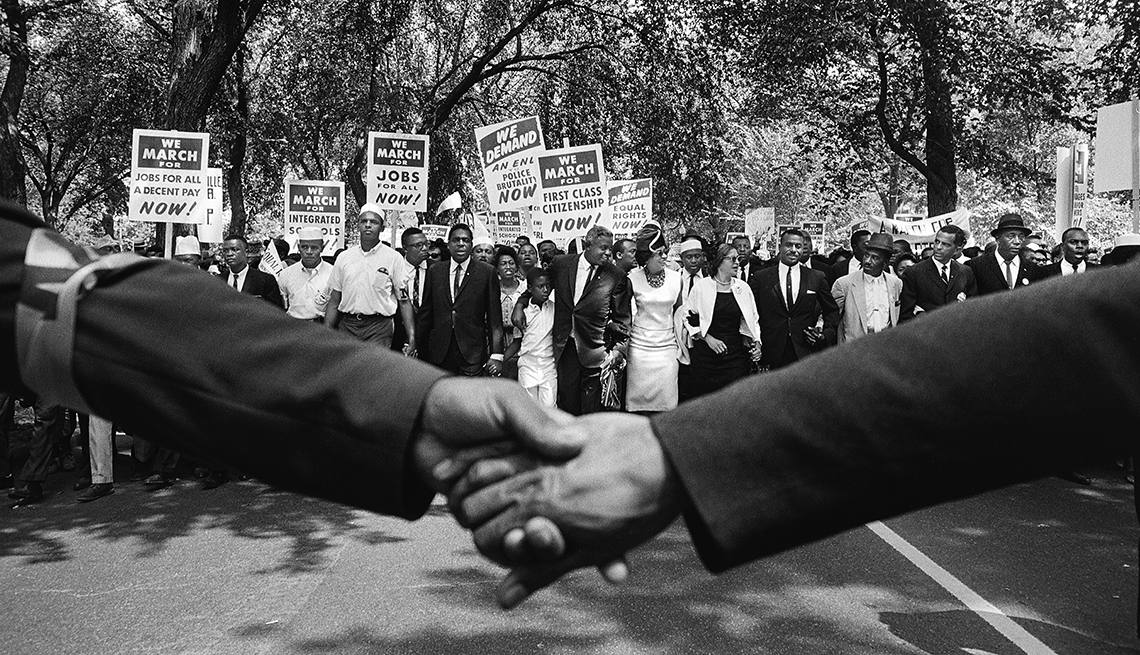 View of the front line of demonstrators during the March on Washington over clasped hands