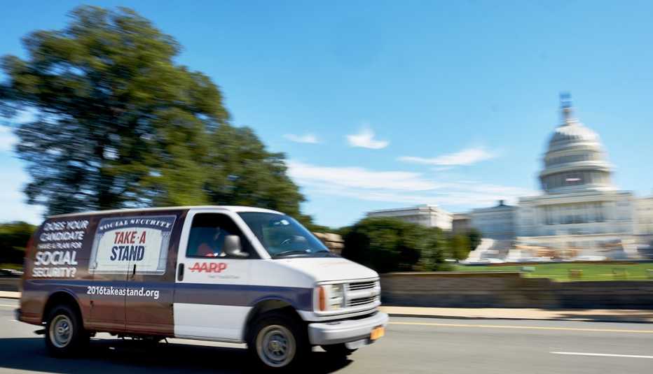 an AARP van drives past the U.S. Capitol building 