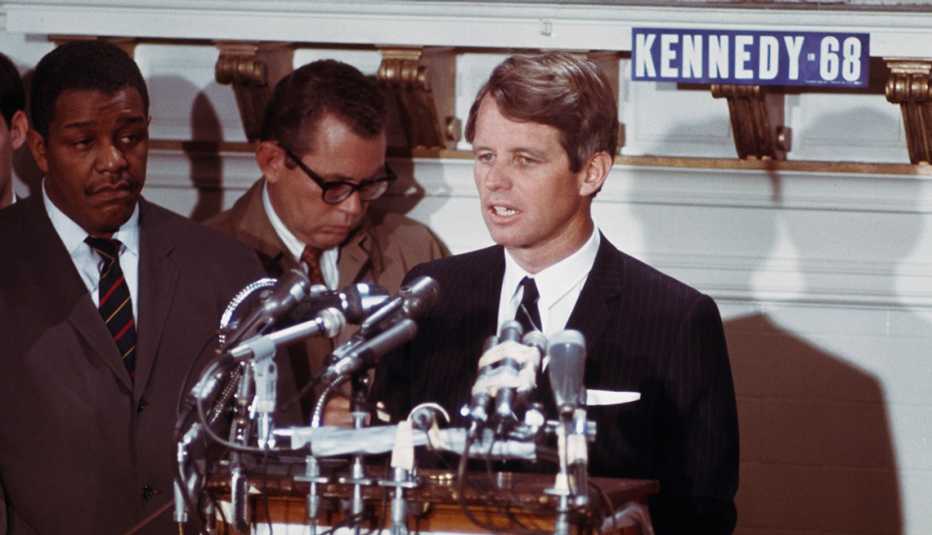 Robert Kennedy standing at a podium.