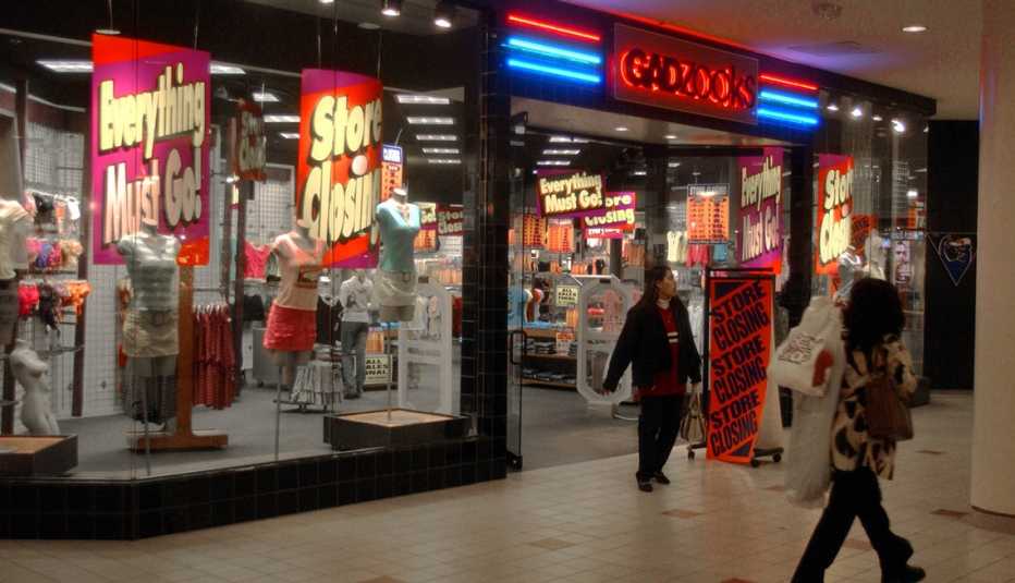 shot of a gadzooks store in an indoor shopping mall with a few shoppers walking by