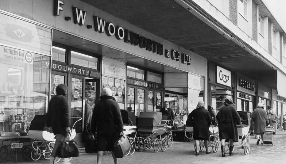 nineteen sixty seven photo of a f w woolworth store facade with shoppers walking in front of it on the sidewalk