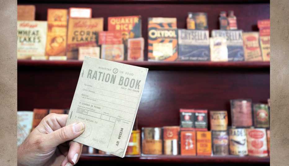 world war two ration book with backdrop of that periods foodstuffs