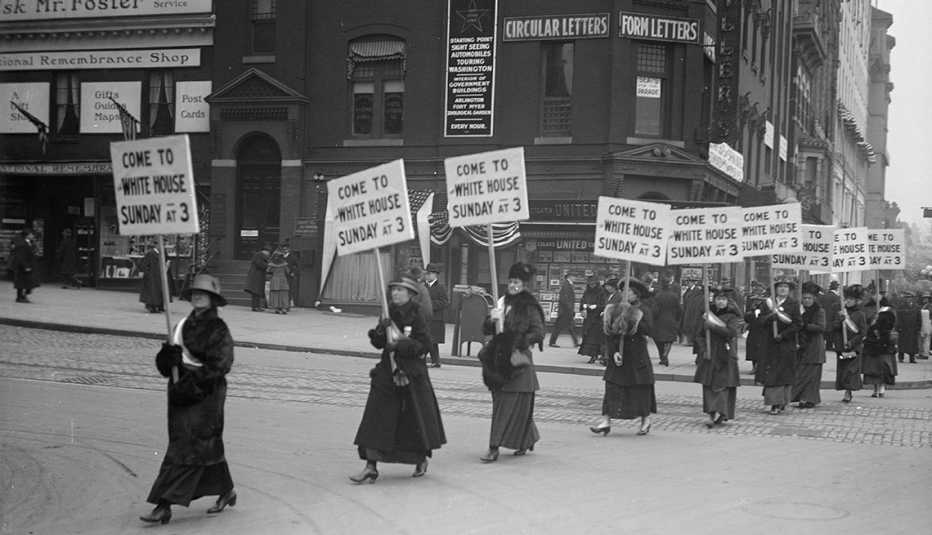 A line of women protesting the right to vote
