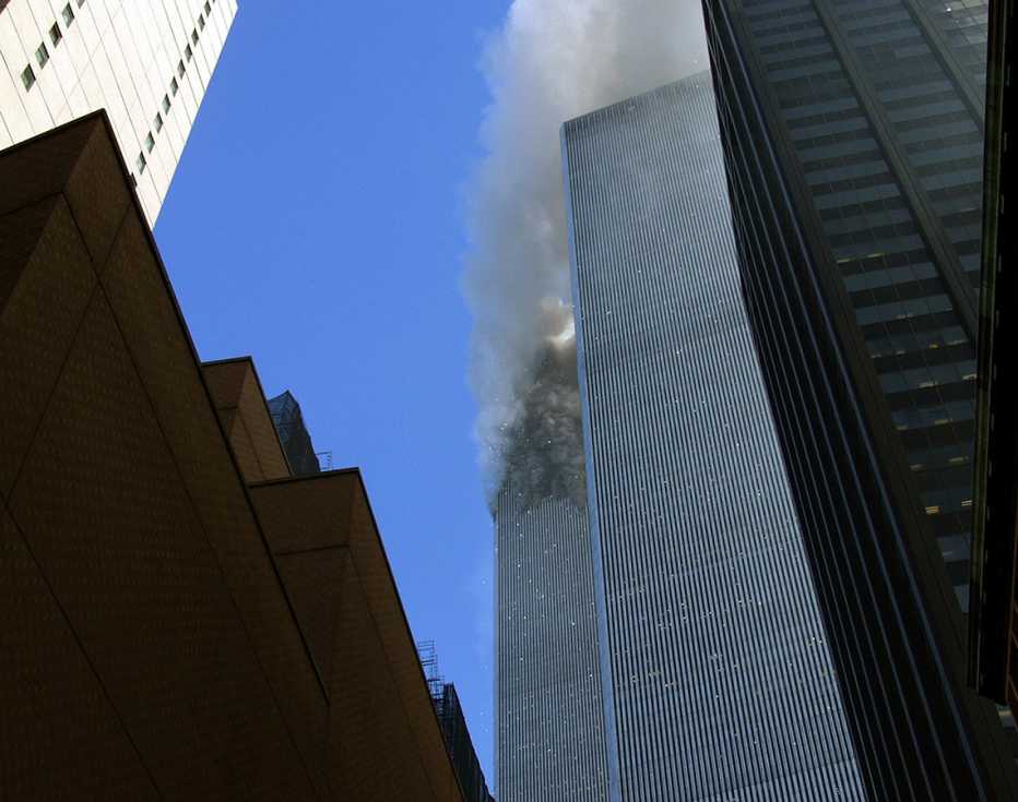 the north tower of the world trade center burns after a plane crashed into it