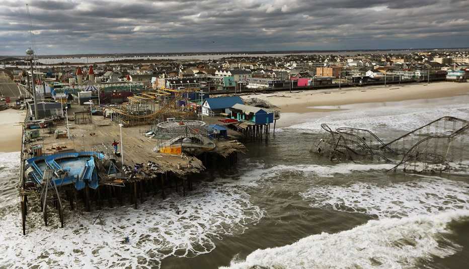 a destroyed boardwalk beach amusement park wrecked by hurricane sandy