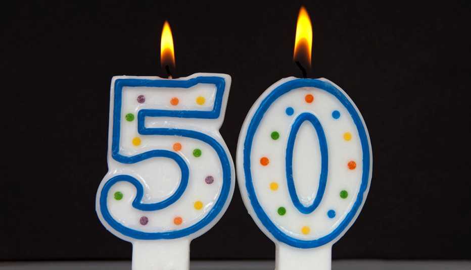 two candles shaped like a five and a zero for fifty 