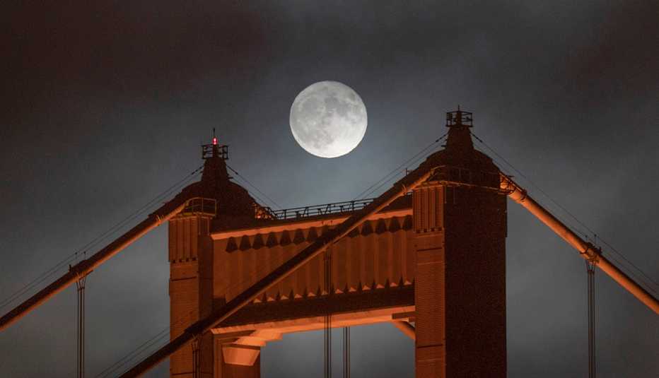 The super moon rises over the Golden Gate Bridge on July 13, 2022 in San Francisco