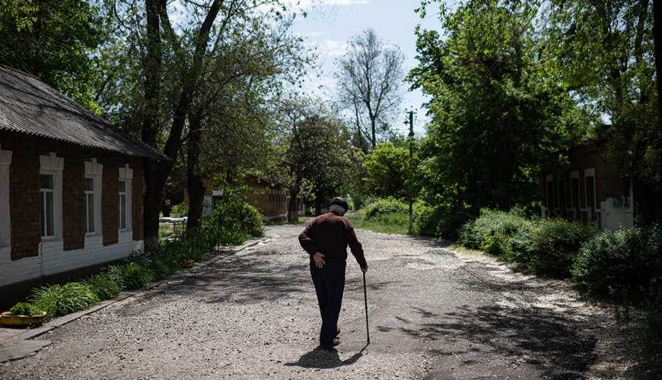 a man walks on the grounds of the care home in Tavriiske  