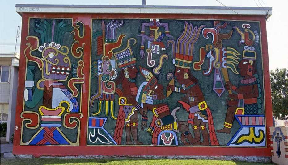 A colorful, untitled mural by artist Charles Felix is pictured at the Estrada Courts housing project in Los Angeles