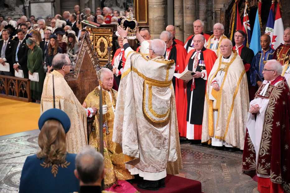 The Archbishop of Canterbury the Most Reverend Justin Welby places the St Edwards Crown on King Charles III.