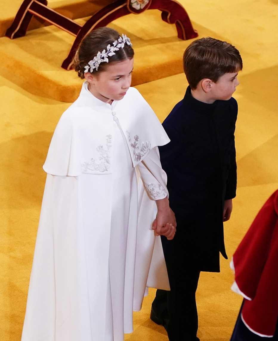 (left to right) Princess Charlotte and Prince Louis hold hands.