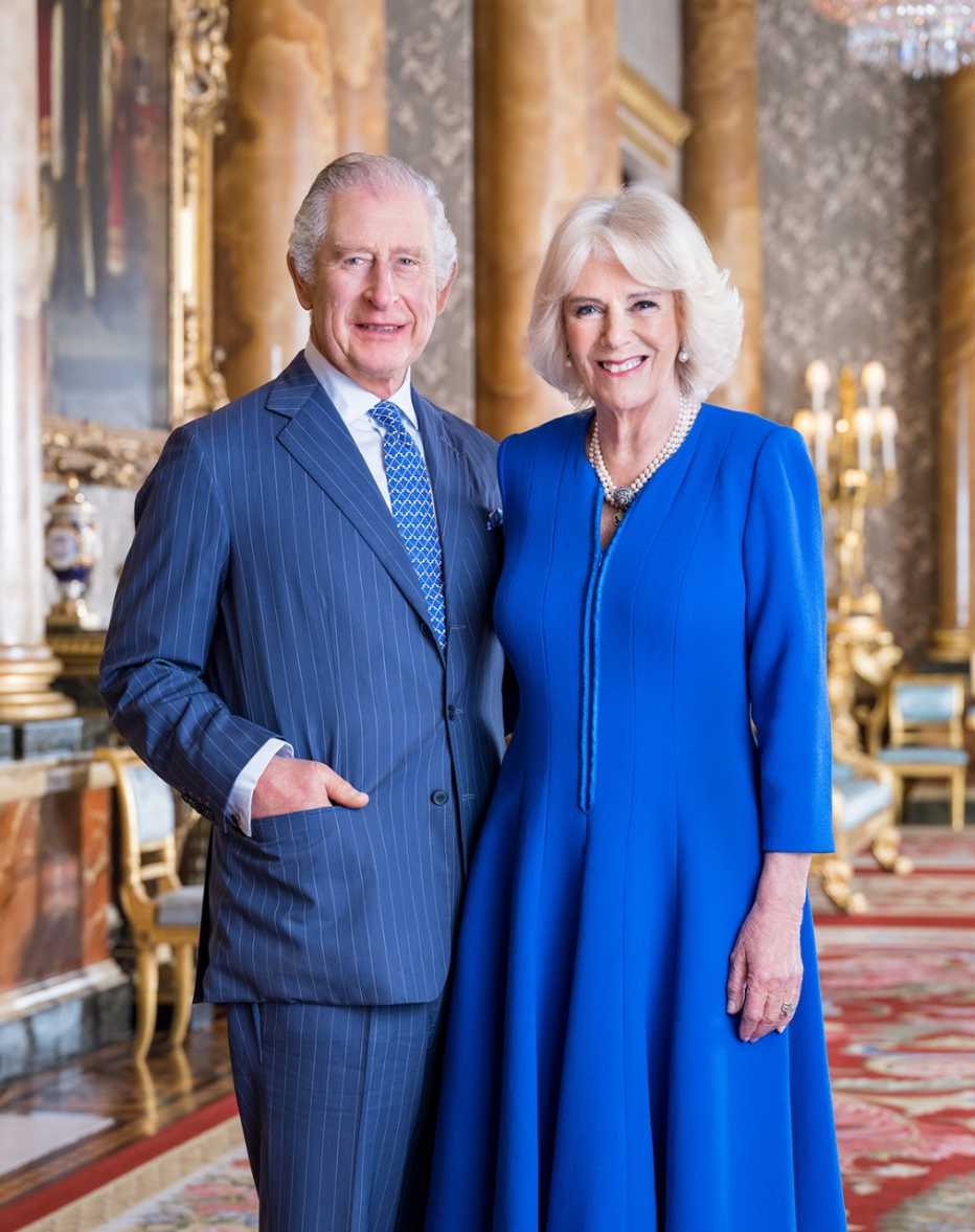 In this handout image released by Buckingham Palace, King Charles III and Camilla, Queen Consort pose for a portrait in the Blue Room at Buckingham Palace on April 4, 2023 in London, England. 