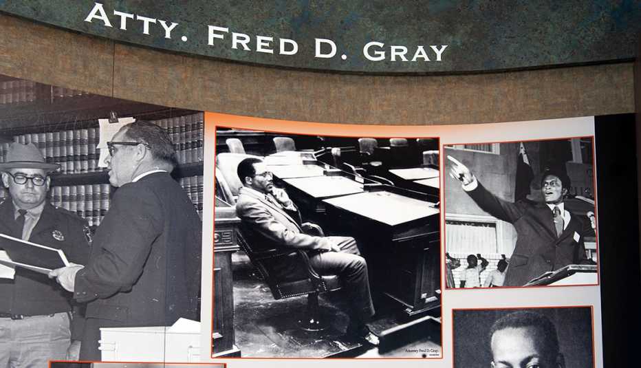 tuskegee center exhibit wall dedicated to attorney fred dee gray one of the photos shows gray after winning election to the alabama house of representatives in nineteen seventy