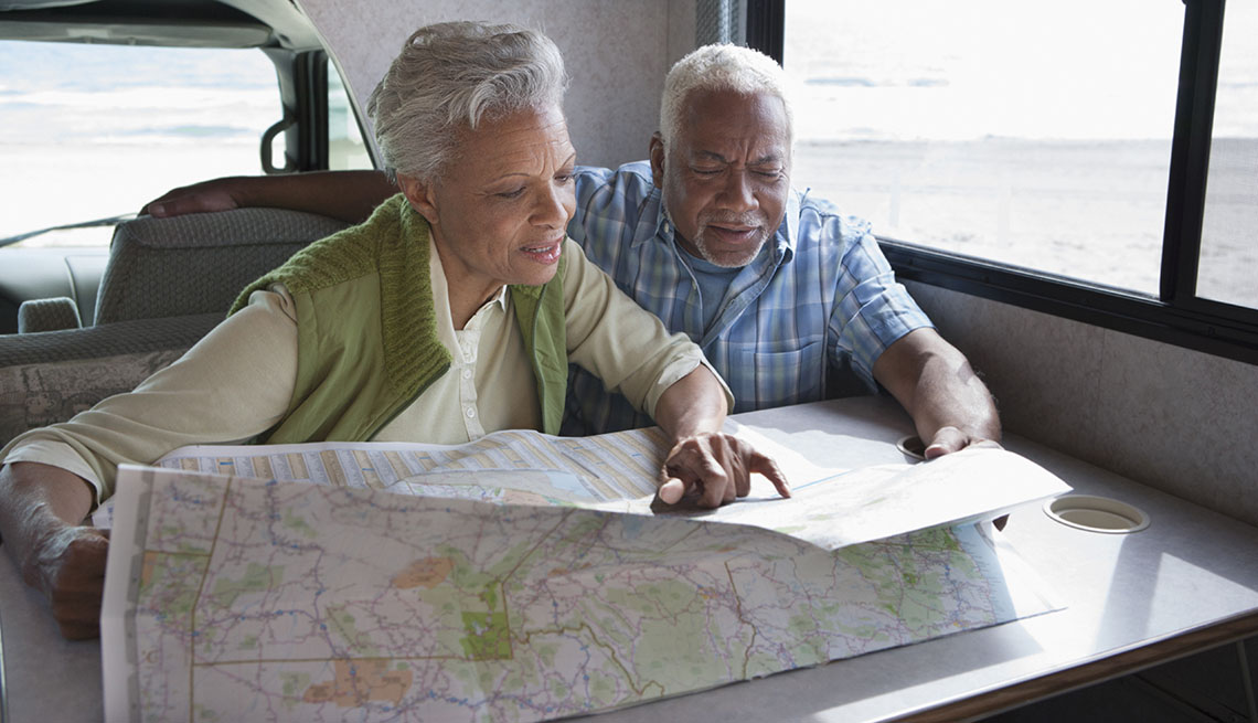 Couple Looking at Map in RV
