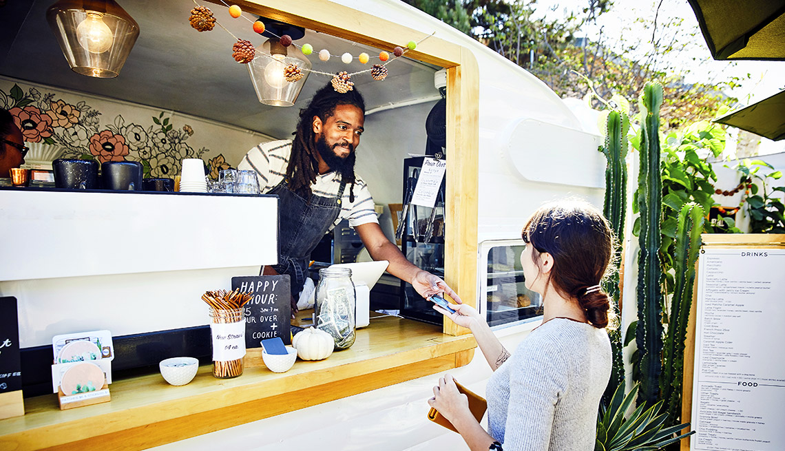 California food truck owner taking customer's credit card payment