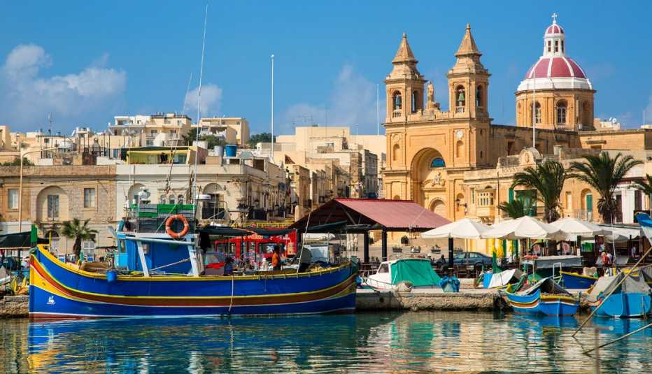 boats in the harbor of a fishing village in malta