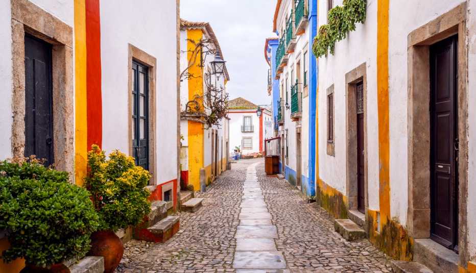 colorful houses on a street in obidos portugal