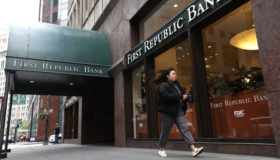 A person walks by a First Republic Bank office on May 01, 2023 in San Francisco, California. Federal Regulators seized troubled lender First Republic Bank on Monday and sold all of its deposits and most of its assets to JPMorgan Chase. First Republic becomes the second largest bank in U.S. history to fail since Washington Mutual failed in 2008.