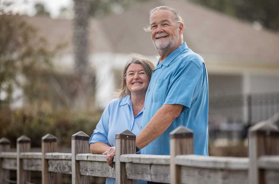Linda (left) and Rob Nehrbas looks out from a bridge at a park nearby their home at Four Seasons at Cane Bay Tuesday Feb. 21, 2023, in Summerville, S.C. 