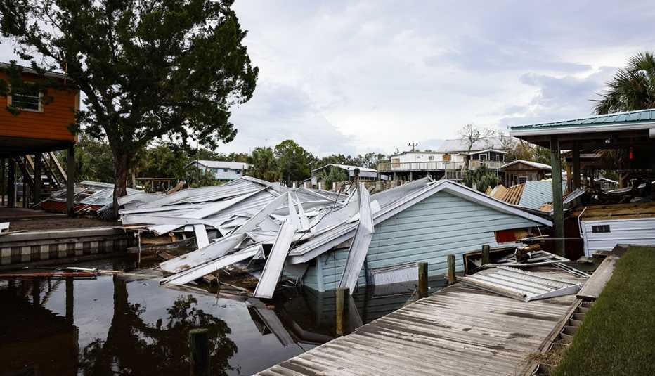 a canal in florida filled with debris after hurricane idalia in august twenty twenty three