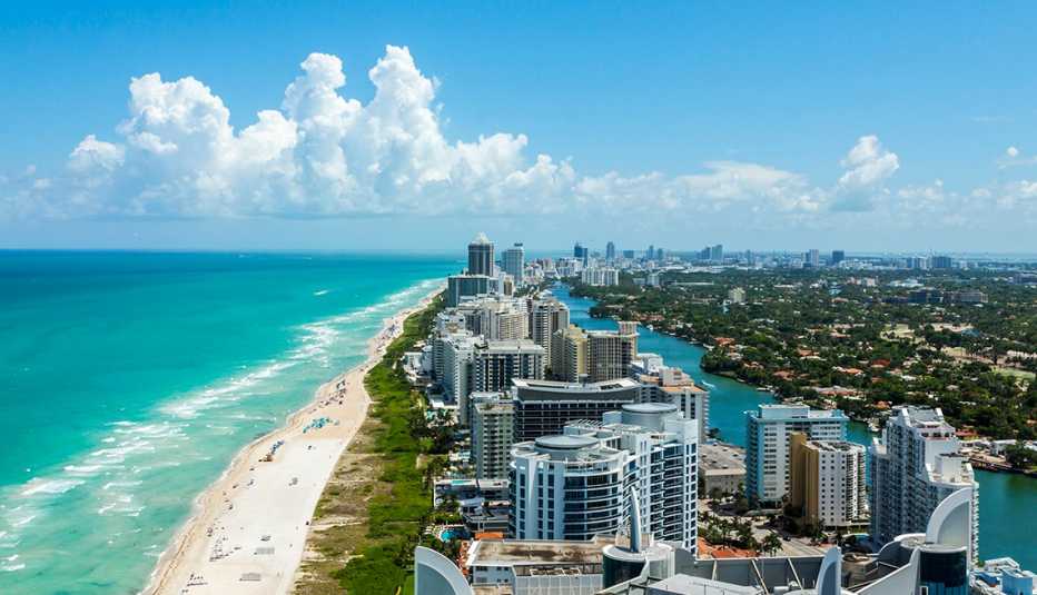 aerial photo of south beach miami showing the city the canal the outer strip of buildings the beach and  the ocean