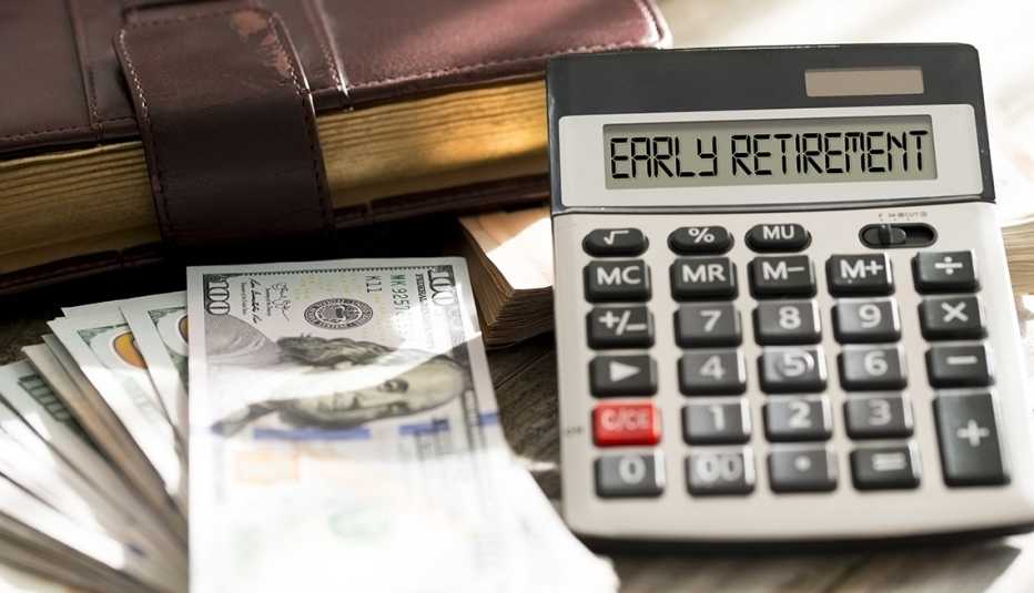 desktop display of a stack of money next to a calculator with the words 'early retirement' in the calculation screen