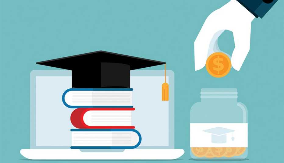 A hand drops a coin into a money jar that sits next to a stack of books with a graduation cap.