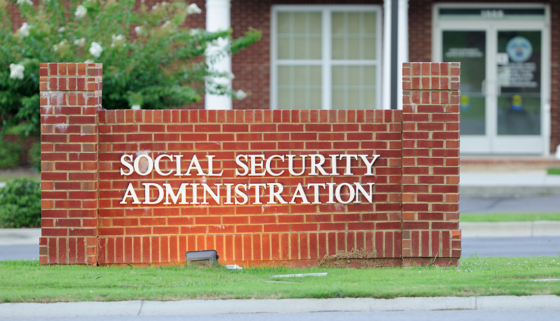 Illuminated social security administration sign in front of building